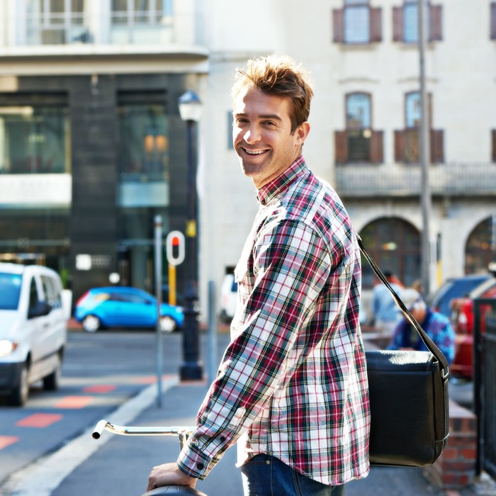 portrait-happy-man-push-bicycle